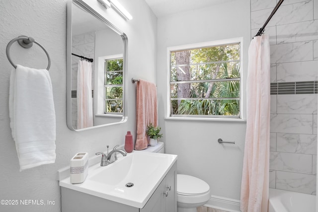 full bathroom with toilet, vanity, a wealth of natural light, and shower / tub combo with curtain