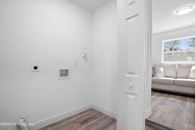 washroom featuring washer hookup, hookup for an electric dryer, baseboards, and wood finished floors