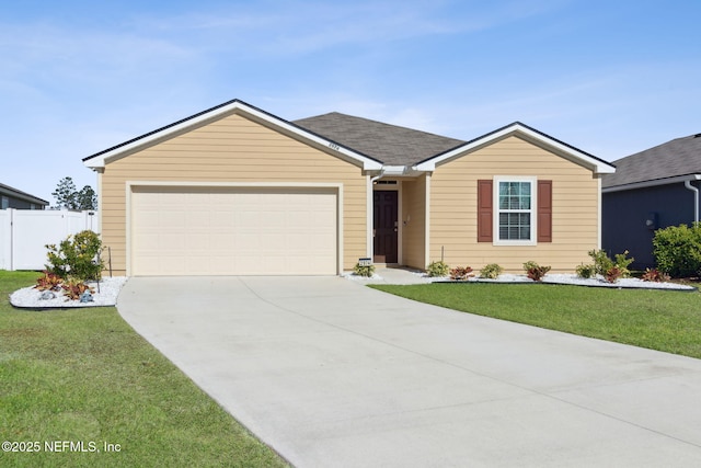 single story home featuring an attached garage, driveway, fence, and a front lawn