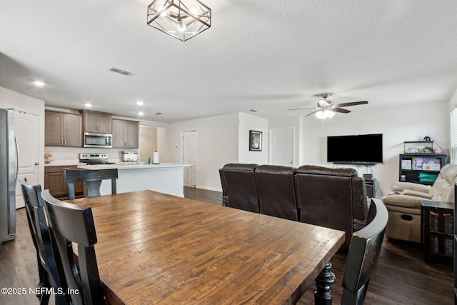 dining room featuring visible vents, dark wood-style flooring, a ceiling fan, and recessed lighting