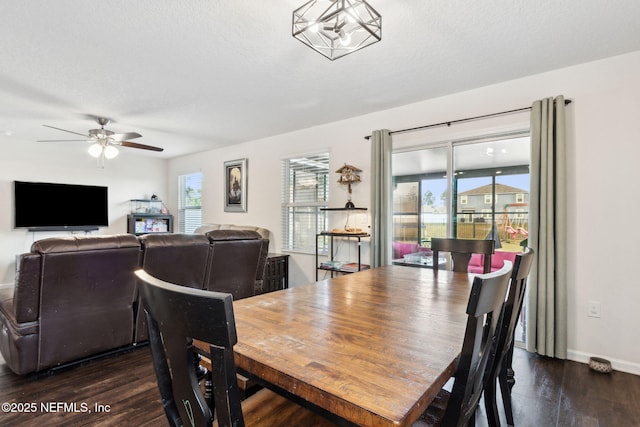 dining room with dark wood-type flooring, plenty of natural light, a textured ceiling, and ceiling fan