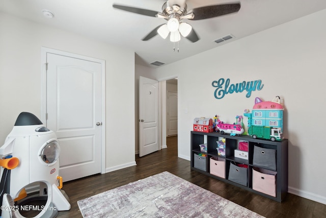 recreation room with baseboards, visible vents, and wood finished floors