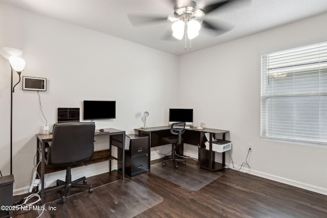 office space featuring a ceiling fan, baseboards, and wood finished floors