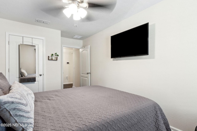 bedroom with visible vents and a ceiling fan