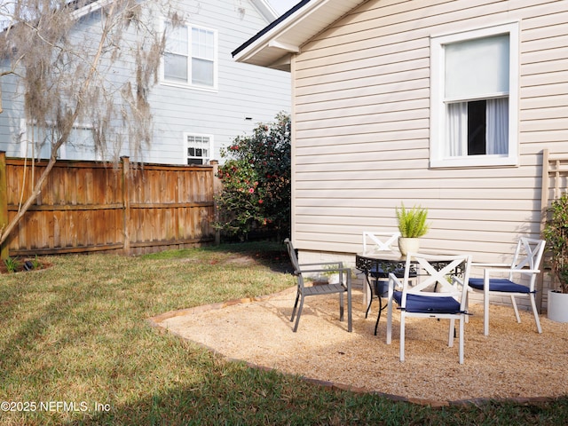 view of yard featuring a patio area and fence