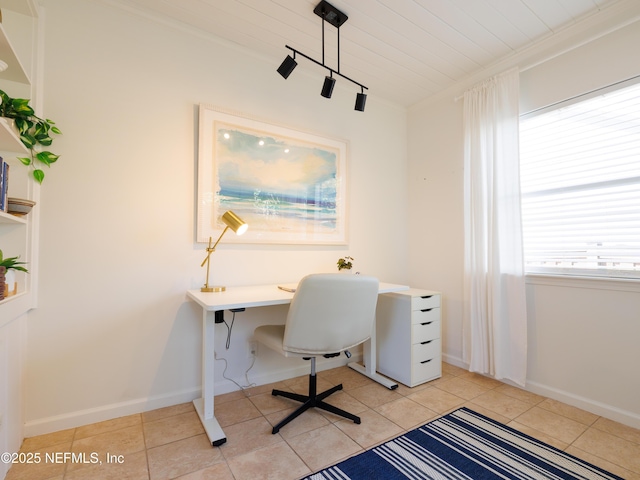 office with ornamental molding, rail lighting, baseboards, and light tile patterned floors