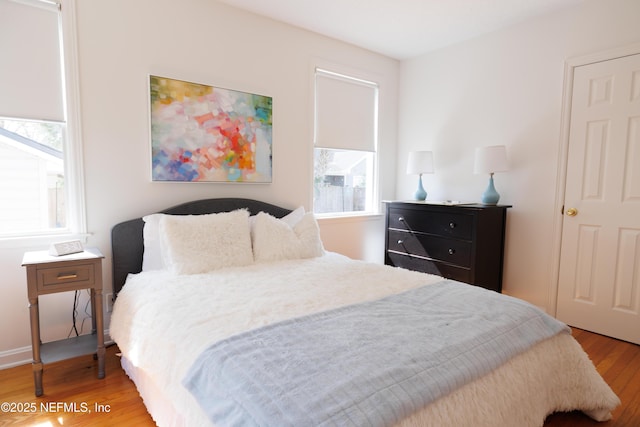 bedroom featuring wood finished floors