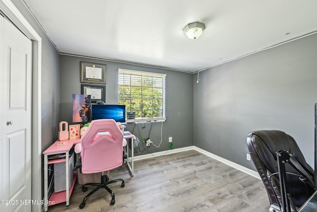 home office with wood finished floors and baseboards