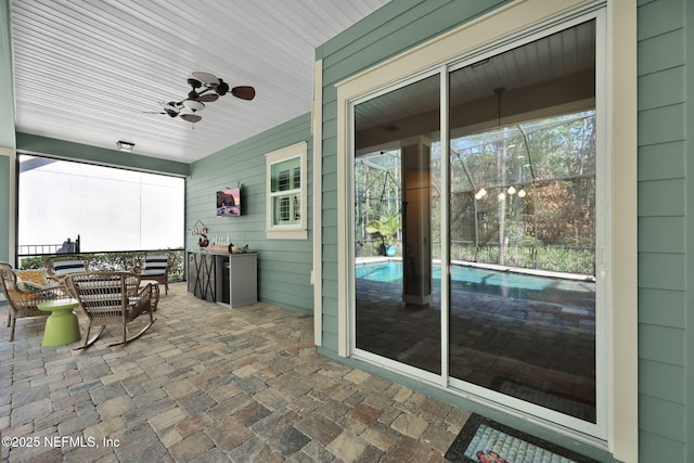 exterior space featuring ceiling fan