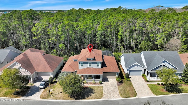 aerial view featuring a view of trees