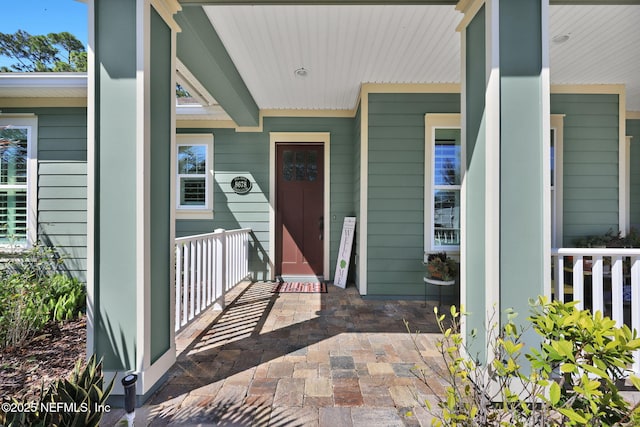 doorway to property with covered porch