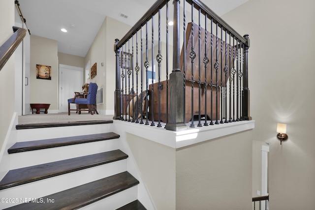 stairway featuring recessed lighting and visible vents