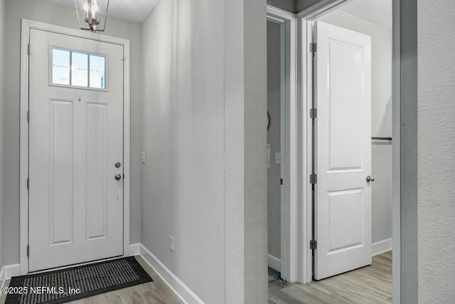 entryway featuring light wood-type flooring and baseboards