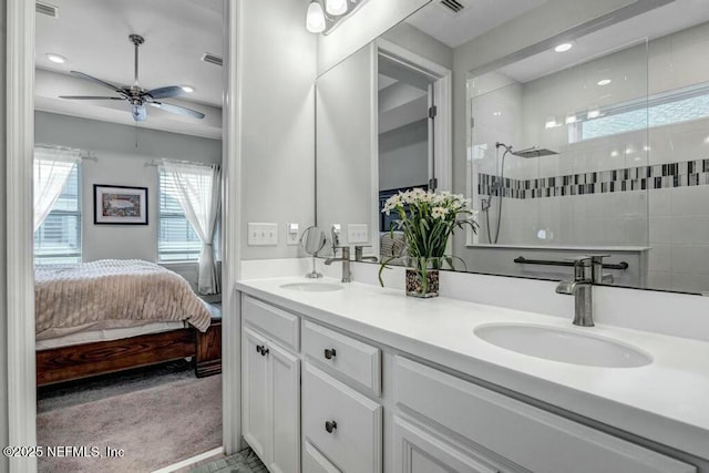 full bath featuring connected bathroom, visible vents, a walk in shower, and a sink