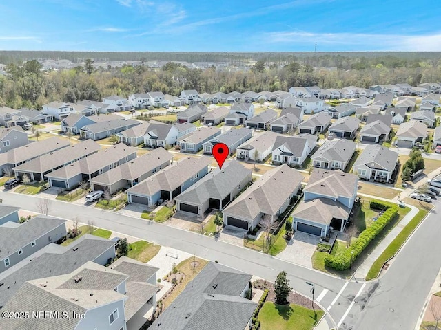 birds eye view of property with a residential view