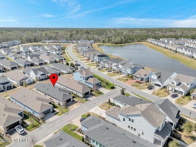 aerial view with a residential view and a water view