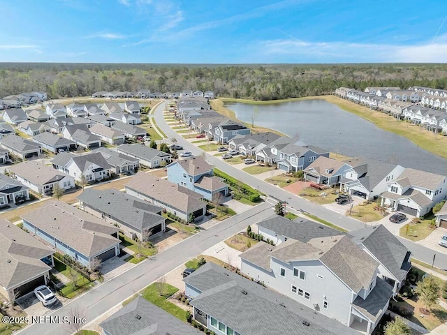 bird's eye view with a water view and a residential view