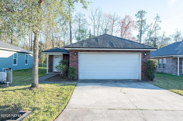 ranch-style house with driveway, a front yard, an outbuilding, and brick siding