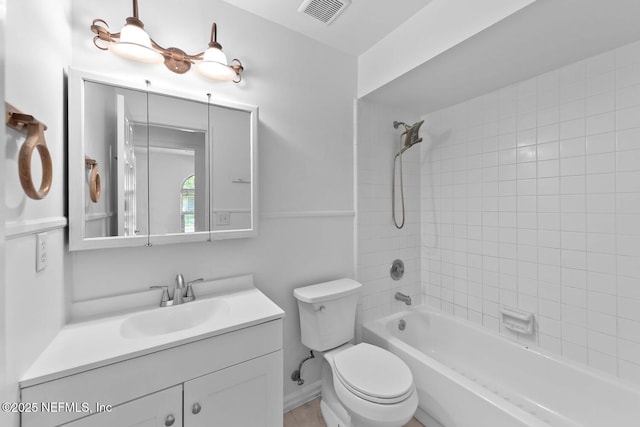 bathroom featuring visible vents, vanity, toilet, and tub / shower combination