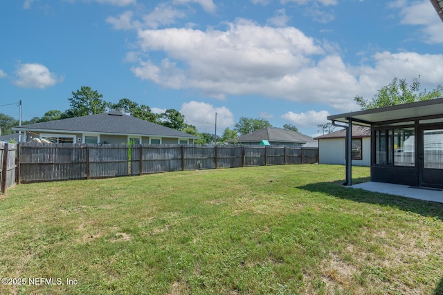 view of yard with a fenced backyard