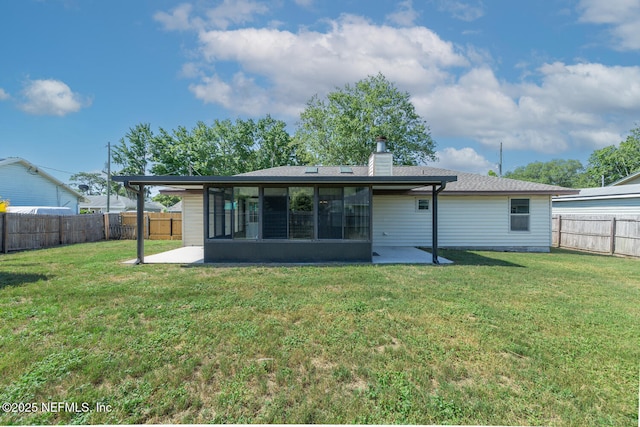 back of house with a patio area, a fenced backyard, and a lawn