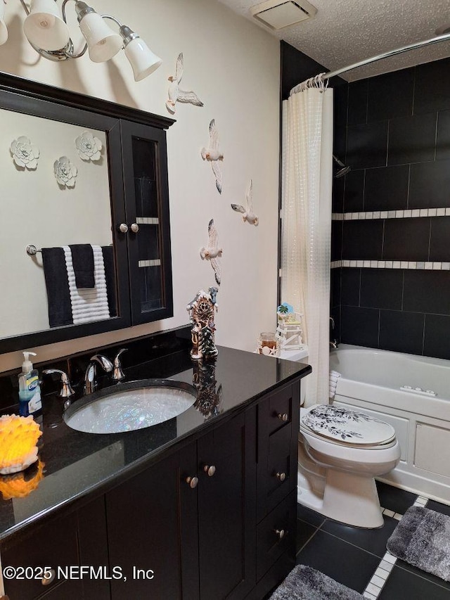 bathroom with tile patterned flooring, toilet, visible vents, vanity, and shower / bath combo with shower curtain