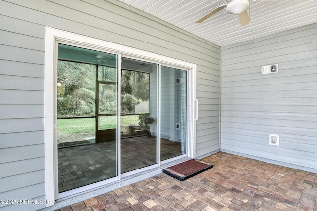 exterior space featuring ceiling fan