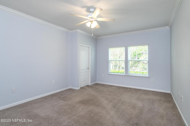 carpeted empty room with baseboards, a textured ceiling, a ceiling fan, and crown molding