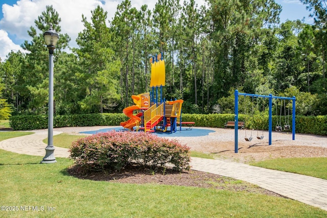 communal playground featuring a lawn