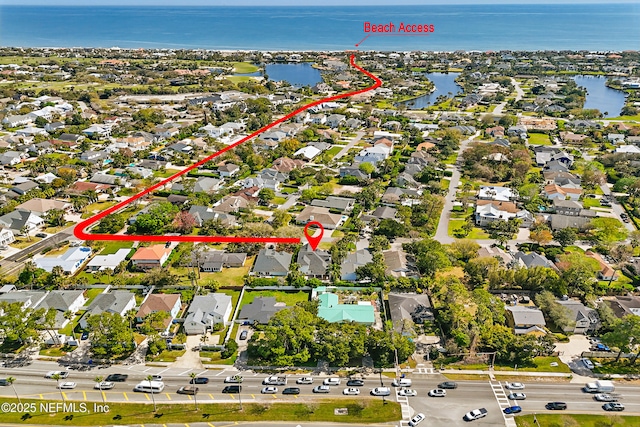 aerial view featuring a water view and a residential view