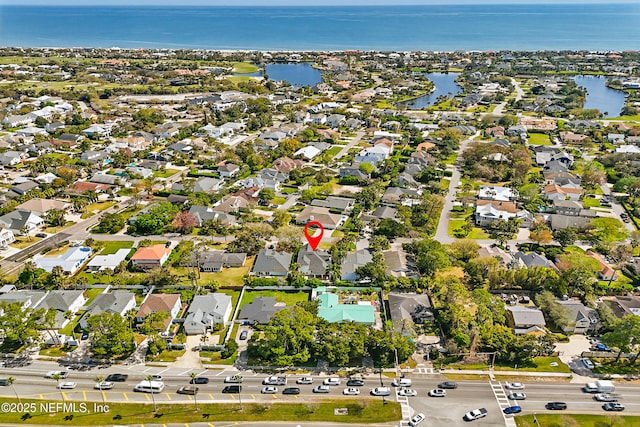 bird's eye view with a water view and a residential view