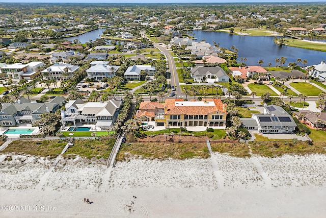 birds eye view of property featuring a residential view and a water view