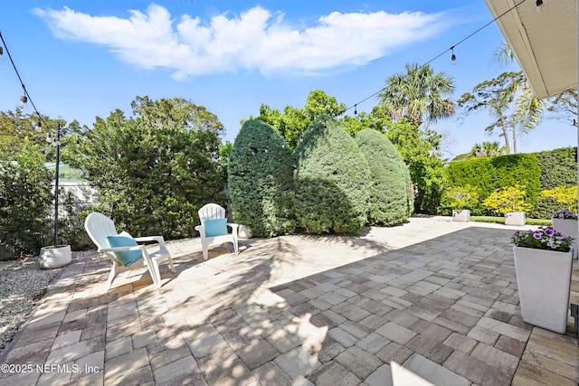 view of patio featuring fence