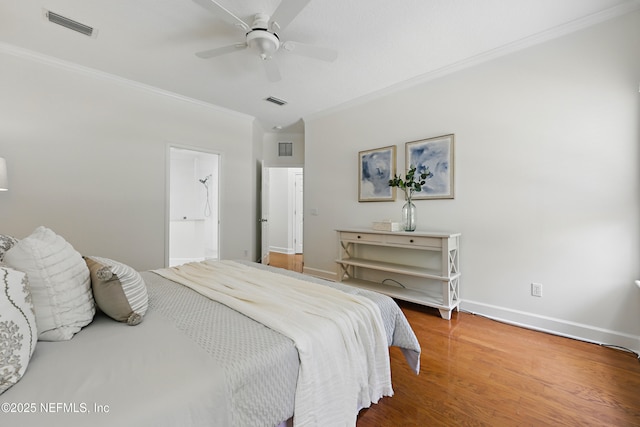 bedroom with visible vents, ornamental molding, a ceiling fan, wood finished floors, and baseboards