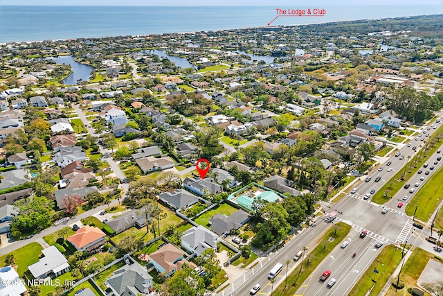 birds eye view of property with a residential view and a water view