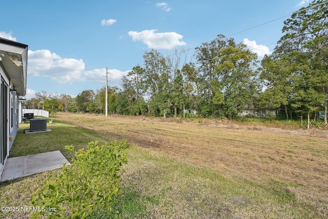 view of yard with central AC