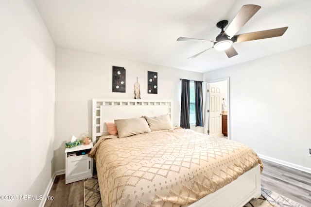 bedroom with a ceiling fan, baseboards, and wood finished floors