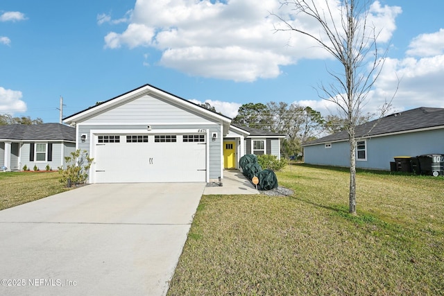 ranch-style home featuring a garage, a front yard, and driveway