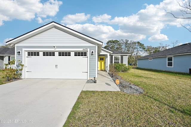 ranch-style house with a garage, driveway, and a front yard