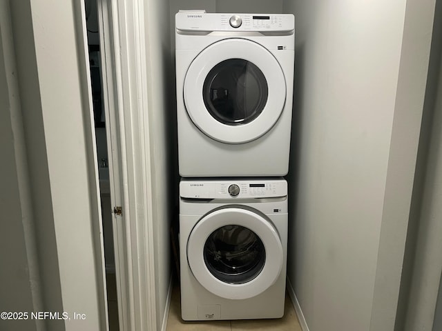 laundry area featuring laundry area and stacked washer / drying machine