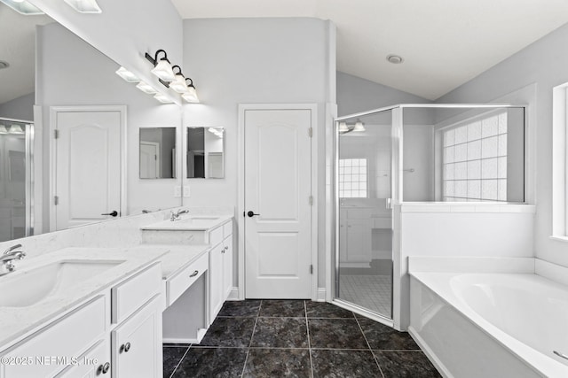 bathroom with a stall shower, plenty of natural light, and a sink