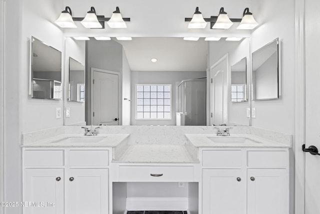 full bathroom with vaulted ceiling, a sink, a shower stall, and double vanity