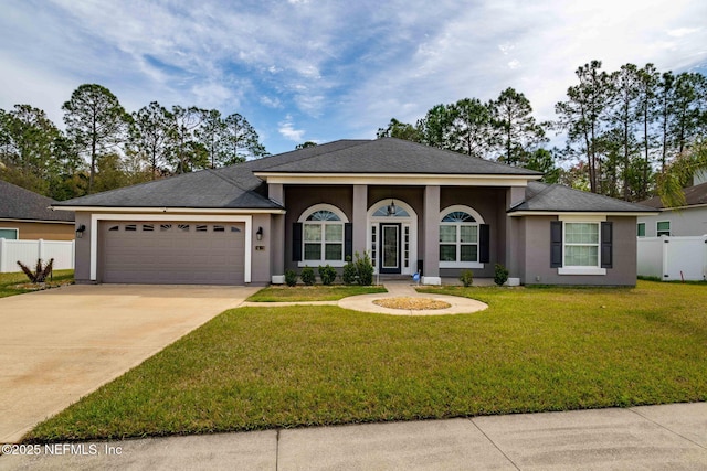 single story home with a garage, fence, driveway, and stucco siding