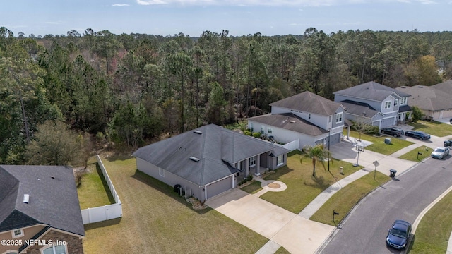 aerial view with a residential view and a view of trees