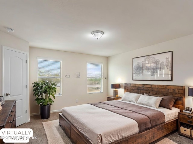 bedroom featuring carpet flooring and baseboards