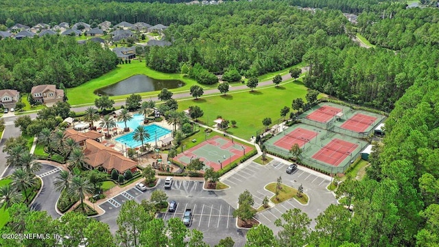 birds eye view of property with a water view