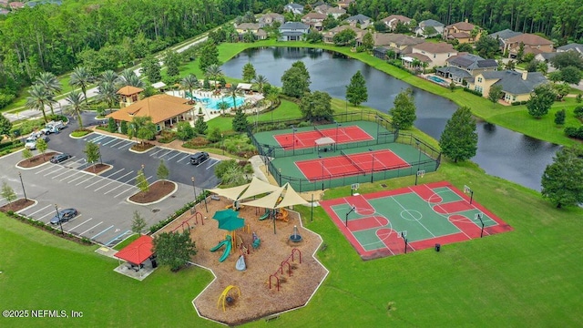 bird's eye view featuring a residential view and a water view