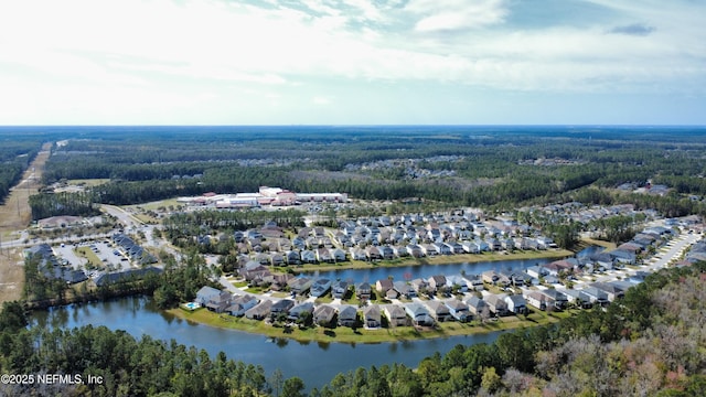 birds eye view of property featuring a water view and a residential view