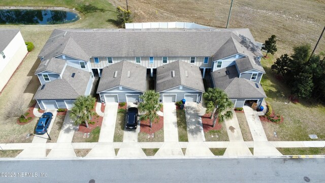 birds eye view of property with a residential view