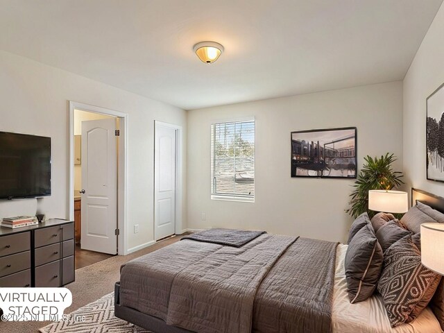 bedroom with carpet and baseboards